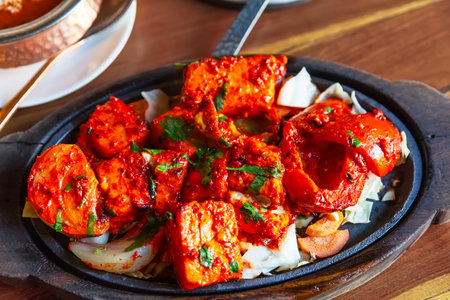 Tandoori Paneer Tikka. Cubes of cottage cheese, tomatoes, bell peppers and onion finished in clay oven. The Indian vegetarian's choice of clay oven cooking.の写真素材