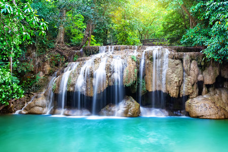 Amazing Erawan waterfall in tropical forest of national park Kanchanaburi in Thailand. Beautiful waterfall with emerald water.の写真素材