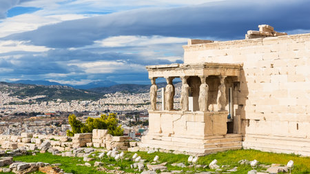 The Porch of the Caryatids on Erechtheion, Acropolis of Athens, Greece. The ancient Erechtheion temple with the beautiful Caryatid pillars in Athens, Greece.の写真素材