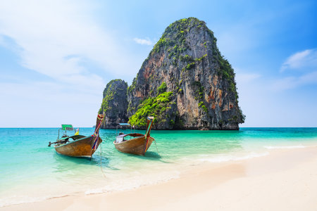Amazing view of Ao Phra Nang Beach with thai traditional wooden longtail boat, white sand and turquoise sea in Krabi province. Ao Nang, Thailand. Travel summer concept.の写真素材