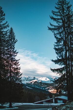 Beautiful day in French alps near small town called Megeve. Winter time in france, snow on mountains, beautiful scenic view.の写真素材