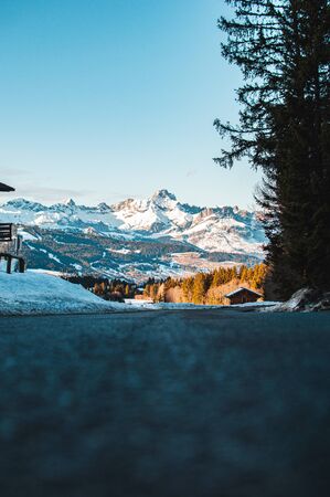 Beautiful day in French alps near small town called Megeve. Winter time in france, snow on mountains, beautiful scenic view.の写真素材
