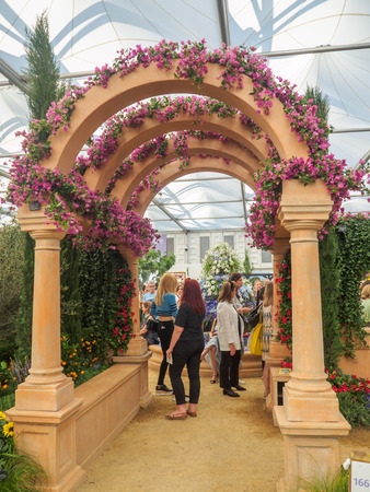 LONDON, UK - MAY 25, 2017: RHS Chelsea Flower Show 2017. The worldâs most prestigious flower show displaying the best in garden design. Visitors observing displays in the Grand Pavilion.のeditorial素材