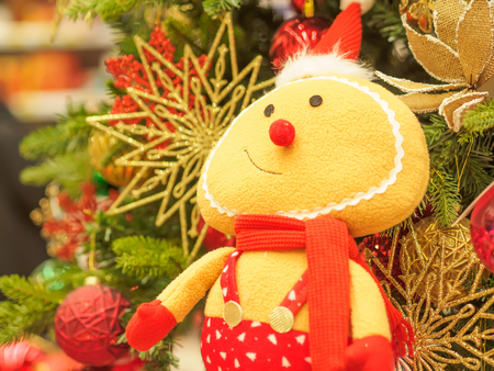 Bright and beautifully decorated with toys Christmas tree against shiny illuminated soft focused background. Christmas and New Year concept.の写真素材