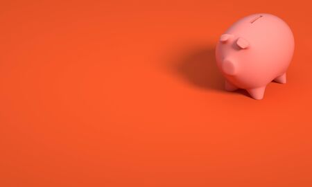 COLOR PHOTO OF PIGGY BANK ON ORANGE BACKGROUNDの写真素材