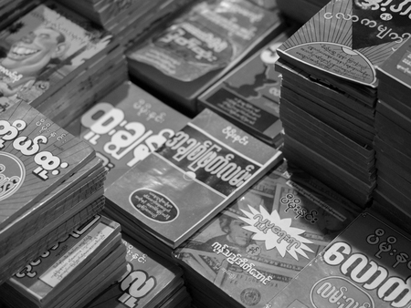 BLACK AND WHITE PHOTO OF DISPLAYED BOOKS FOR SALE AT BOOKSTOREのeditorial素材