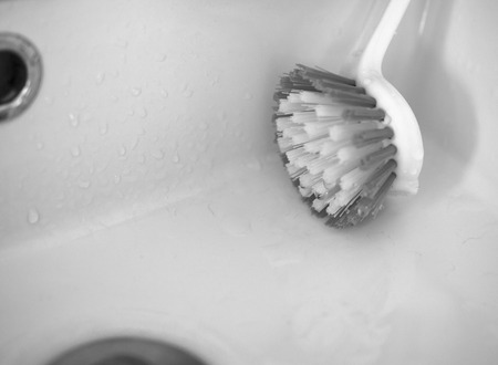BLACK AND WHITE PHOTO OF WET BRUSH IN THE BASINの写真素材