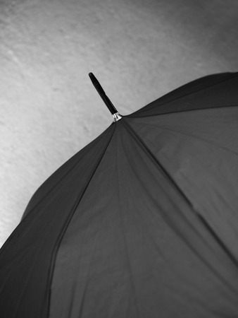 BLACK AND WHITE PHOTO OF CLOSE-UP OF UMBRELLAの写真素材