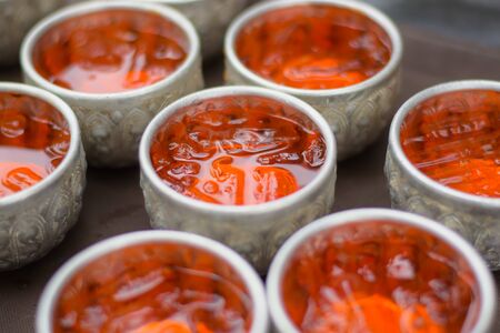 This is Bael fruit juice put in a Thai style glass.の写真素材