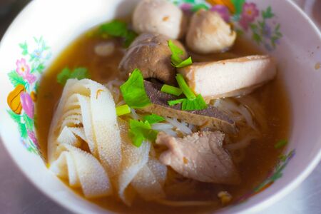 Kuy teav or kway teow is a Cambodian noodle soup consisting of rice noodles with pork stock and toppings.の写真素材