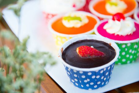 A cupcake is a small cake designed to serve one person, which may be baked in a small thin paper or aluminum cup.の写真素材