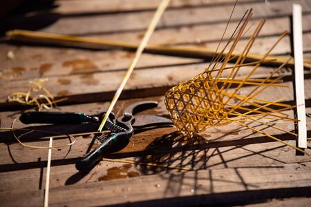 Basket weaving (also basketry or basket making) is the process of weaving or sewing pliable materials into two- or three dimensional artifacts, such as mats or containers.の写真素材