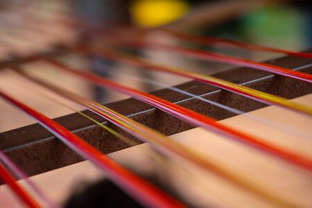 Weaving is a method of textile production in which two distinct sets of yarns or threads are...