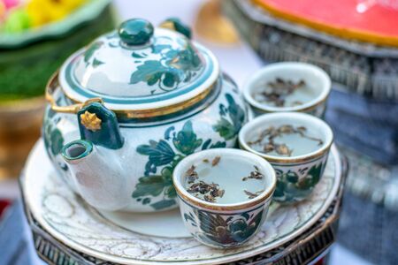 A teapot is a vessel used for steeping tea leaves or a herbal mix in boiling or near-boiling water, and for serving the resulting infusion which is called tea.の写真素材