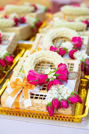 a wreath of flowers and leaves, worn on the head or hung as a decoration.の写真素材