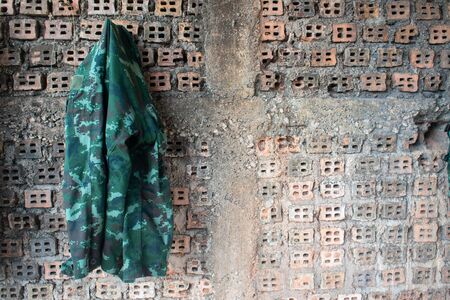 The military shirt hung on the wall.の写真素材