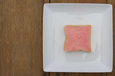 sliced bread with jam on wood backgroundの写真素材