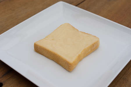 sliced bread with jam on wood backgroundの写真素材