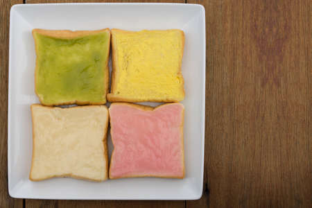 sliced bread with jam on wood backgroundの写真素材