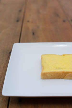 sliced bread with jam on wood backgroundの写真素材