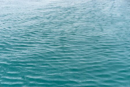 blue water surface reflection backgroundの写真素材