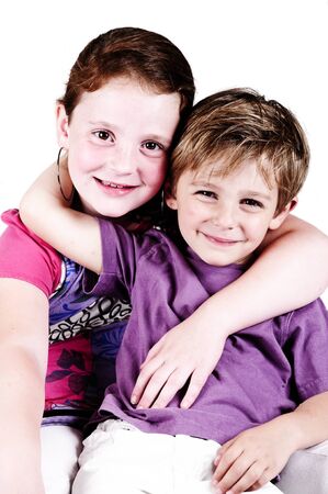 brother and sister taken in a studio isolatedの写真素材