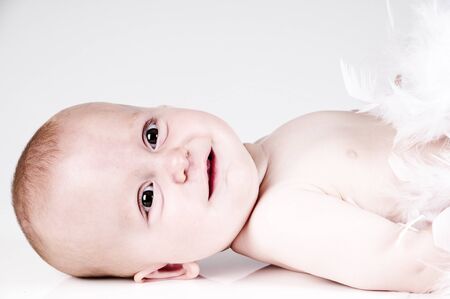 baby taken in a studio with a white backgroundの写真素材