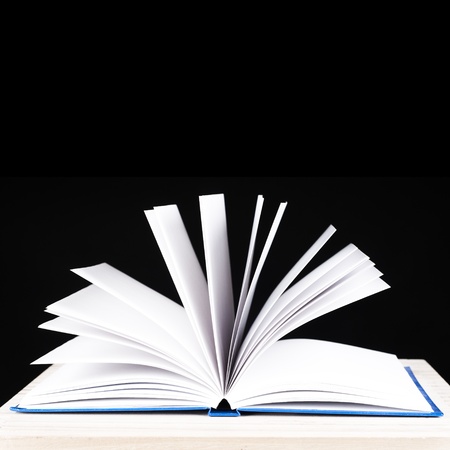 open book on a black background for cutoutの写真素材