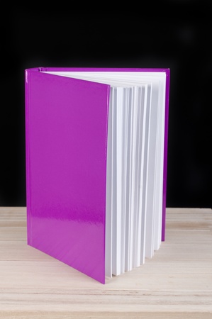 pink book on a black studio backgroundの写真素材