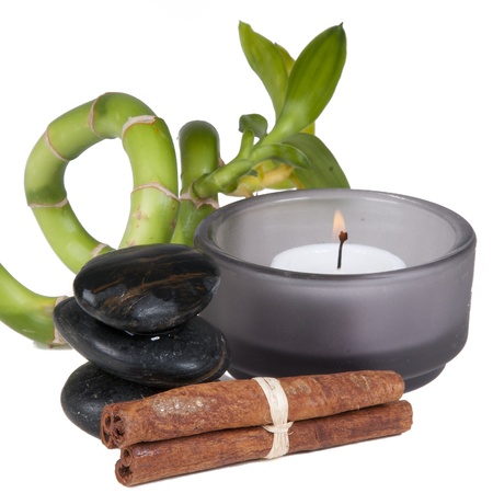 Spa set with candle and bamboo on white backgroundの写真素材