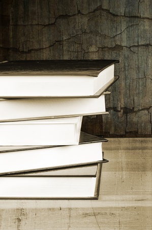 pile of old books in a vintage settingの写真素材