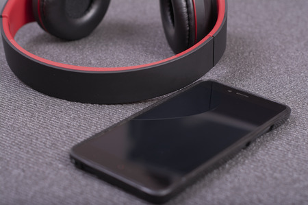 smartphone with headphones to listen to musicの写真素材