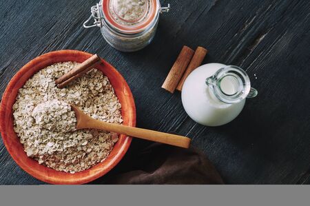 oat flakes with cinnamon and milkの写真素材