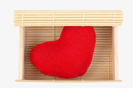 bamboo box with heart on white backgroundの写真素材