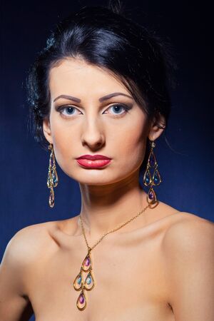 Portrait of elegant beautiful woman wearing jewelry.の写真素材