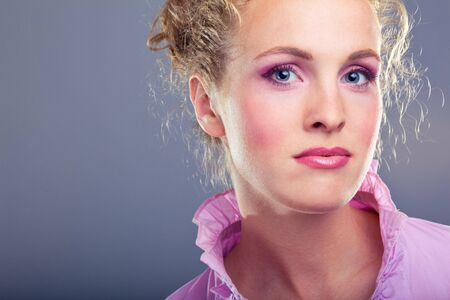 Portrait of beautiful lady on blueの写真素材