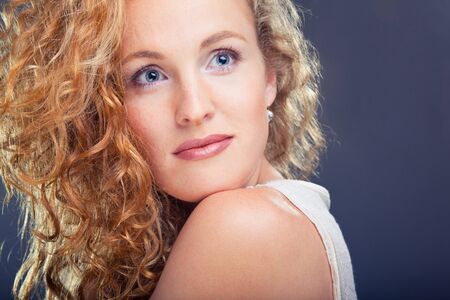 Portrait of beautiful lady on blueの写真素材