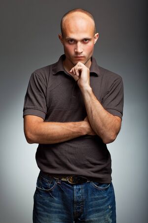 pensive young man in shirtの写真素材