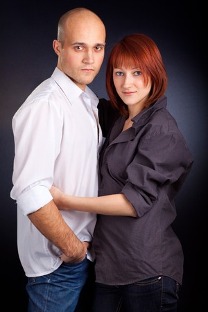 Attractive Couple against a Black Background の写真素材