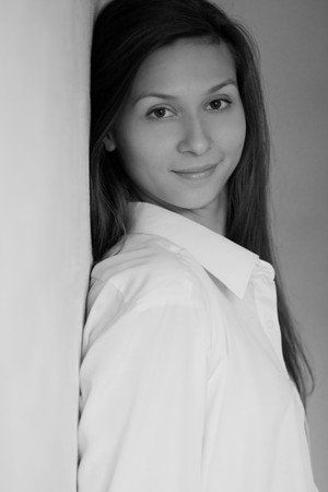 Glamour portrait of young woman at the wallの写真素材