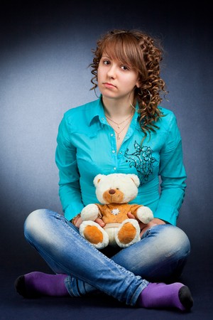 Pretty young teen with teddyの写真素材