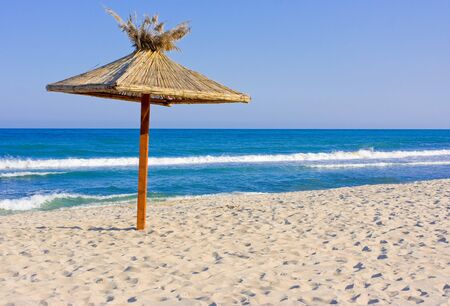beach at summer with umbrellaの写真素材