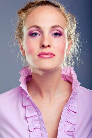 Portrait of beautiful lady on blueの写真素材