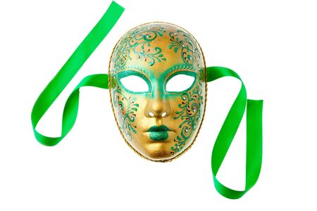 green and gold mask isolated on a white backgroundの写真素材