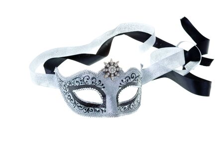 silver and black carnival mask isolated on a white backgroundの写真素材