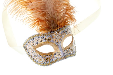 gold feathered carnival mask isolated on a white backgroundの写真素材