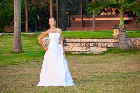 Beautiful young bride in dress outdoorsの写真素材
