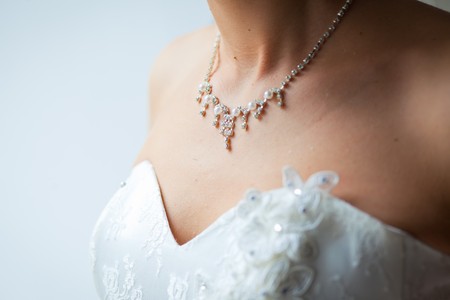 Beautiful adornment on neck of young brideの写真素材