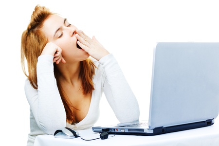 young adult red haired business lady  over white frustrated with her computerの写真素材