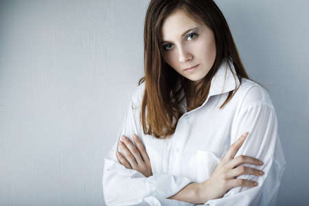 Portrait of a beautiful female model on white backgroundの写真素材